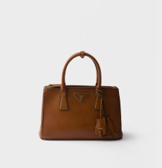 Prada Galleria Medium Handbag Cognac Smooth Leather Hand‑Stitched Woven Edge Gold‑Tone Metal Triangle Logo Zipper Closure Tassel Charm Ladies Medium‑Capacity Top‑Handle Shoulder Handbag
